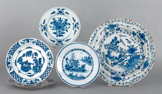 Four Delft blue and white plates, 18th c., 9" dia.