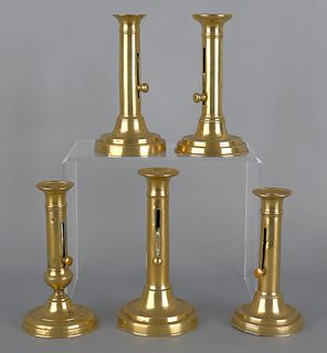 Five brass slide ejector candlesticks, 19th c.