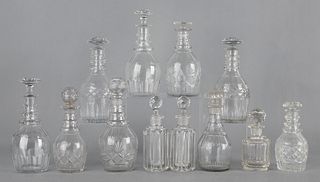 Twelve cut glass decanters, tallest - 10 1/2".