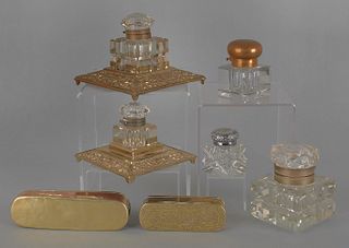 Five brass and cut glass inkwells, together with t