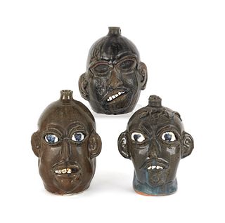 Three Georgia stoneware face jugs by Chester Hewel