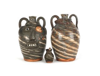 Two North Carolina stoneware jugs, together with a