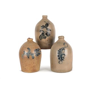Three American stoneware jugs, 19th c., with cobal
