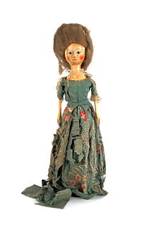 English Queen Anne wooden doll, with brown glass e