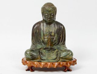 PATINATED BRONZE OF A SEATED BUDDHA
