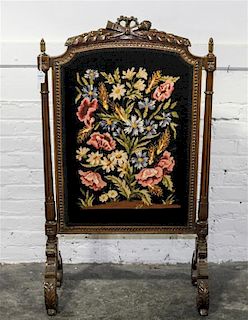 A Louis XVI Style Needlepoint Firescreen Height 43 1/2 x width 25 inches.
