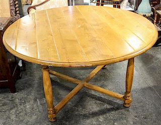 A Provincial Pine Dining Table Height 30 x diameter 55 inches.