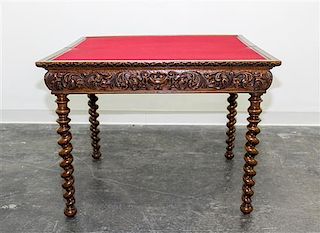 * A Jacobean Revival Style Flip Top Games Table. Height 26 1/4 x width 34 1/2 x depth 17 1/4 inches.