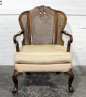A Queen Anne Style Caned Open Armchair. Height 40 1/2 inches.