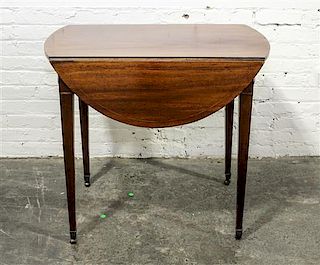 * An English Mahogany Drop Leaf Table Height 28 x width 18 1/2 x depth 31 inches (closed).