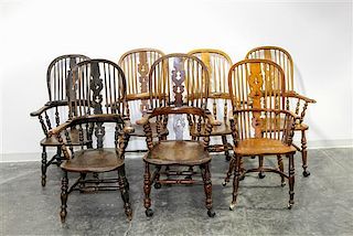 * An Assembled Set of Seven Windsor Style Armchairs Height of tallest 46 1/2 inches.