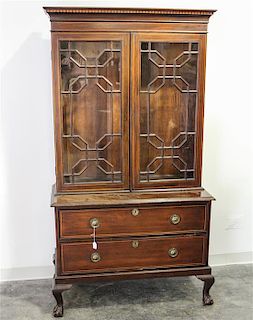 A Chippendale Style Walnut Three Part Bookcase Height 74 x width 40 1/2 x depth 19 inches.