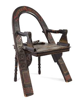 After Vasili Petrovich Shutov, RUSSIA, a Trompe L'Oeil armchair having an arched back with inscriptions, axe arm supports and