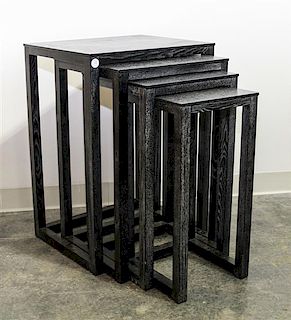 A Set of Four Black Cerused Wood Nesting Tables. Height 27 1/2 inches.