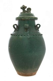 * A Green Glazed Earthenware Covered Jar Height 18 1/2 inches.