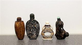 Four Carved Snuff Bottles Height of tallest 3 1/2 inches.
