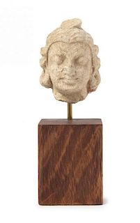 * A Gandharan Stucco Head of a Warrior Height 2 inches.