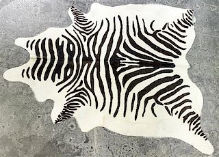 * A Faux Zebra Rug 7 feet 3 inches x 5 feet 7 inches.