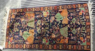 * A Northwest Persian Pictorial Wool Rug 6 feet 10 inches x 3 feet 9 inches.