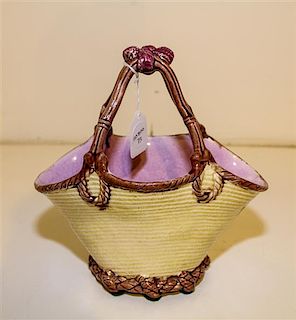 A Majolica Basket. Height 9 1/4 inches.