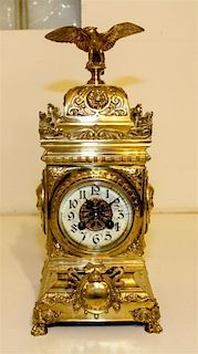 A French Brass Mantle Clock. Height 16 inches.