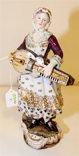 * A German Porcelain Figure Height 12 1/4 inches.