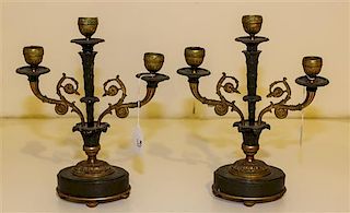 A Pair of Empire Gilt and Patinated Bronze Three-Light Candelabra. Height 10 1/2 inches.