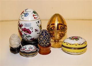 A Group of Six Porcelain Eggs and Egg-Form Boxes Height of tallest 5 3/4 inches.