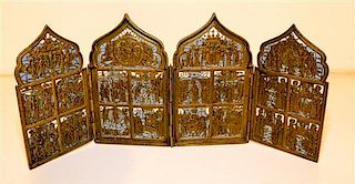 An Eastern European Enameled Brass Four-Panel Icon. Height 7 inches.