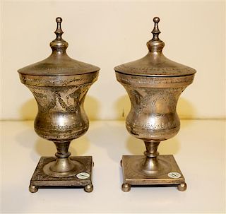 A Pair of Silvered Metal Covered Urns. Height 13 inches.