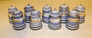 A Set of Nine Blue Onion Porcelain Canisters Height of each 4 inches.