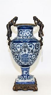 * A Gilt Metal Mounted Blue and White Porcelain Vase. Height 19 inches.