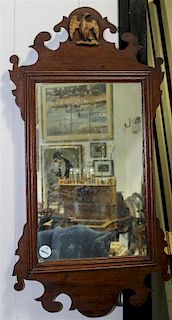A Chippendale Mahogany Parcel Gilt Mirror Height 28 x width 14 1/2 inches.