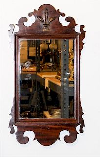 * A Chippendale Style Mahogany Mirror Height 24 1/2 x width 13 1/2 inches.