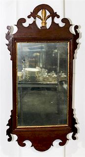 * A Chippendale Mahogany Parcel-Gilt Mirror Height 30 x width 14 1/4 inches.