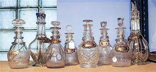 * A Group of Eight Cut Glass Liquor Bottles Height of tallest 11 3/4 inches.