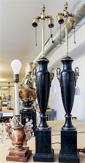 A Pair of Brass and Ebonized Lamps Height 35 inches.