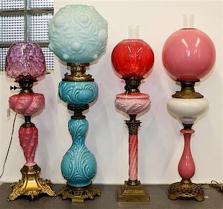 Four Victorian Fluid Lamps Height of tallest 38 inches.