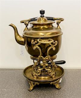 * A Brass Teapot and Stand Height of teapot on stand 10 inches.
