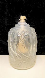 * A Rene Lalique Frosted Glass Oil Lamp. Height 5 3/4 inches.