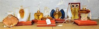 * A Group of Eight Lalique Glass Perfume Bottles. Height of tallest 5 inches.