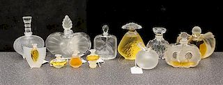 * A Group of Twelve Lalique Glass Perfume Bottles Height of tallest 4 3/4 inches.