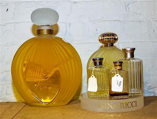 * Five Lalique and Other French Glass Perfume Bottles. Height of tallest 11 1/2 inches.
