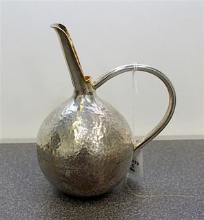 A Greek Silver Wine Jug, Michalas, Athens, the body of globular form with a spot hammered finish having a handle connecting t