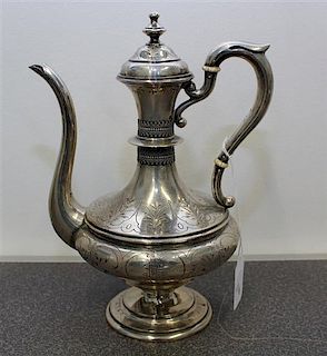 An Austro-Hungarian Silver Teapot Height 9 1/2 inches.