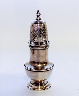 * An English Silver Muffineer, Marshall Field & Co., London, 1948, having an urn finial surmounting a baluster form body, tog