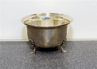 An American Silver Bowl, Georg Jensen USA, New York, NY, having an out turned rim and raised on three foliate form feet.