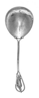 An American Silver Berry Spoon, makers mark obscured, possibly Phullis Sklar, having a wire handle decorated with a floral bl