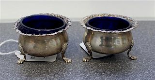 A Pair of English Silver Salts, Robert Stebbings, London, 1924, the rims with floral and foliate volute decorations and raise