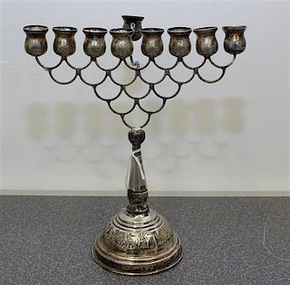 A Continental Silver Menorah Height 8 1/4 inches.